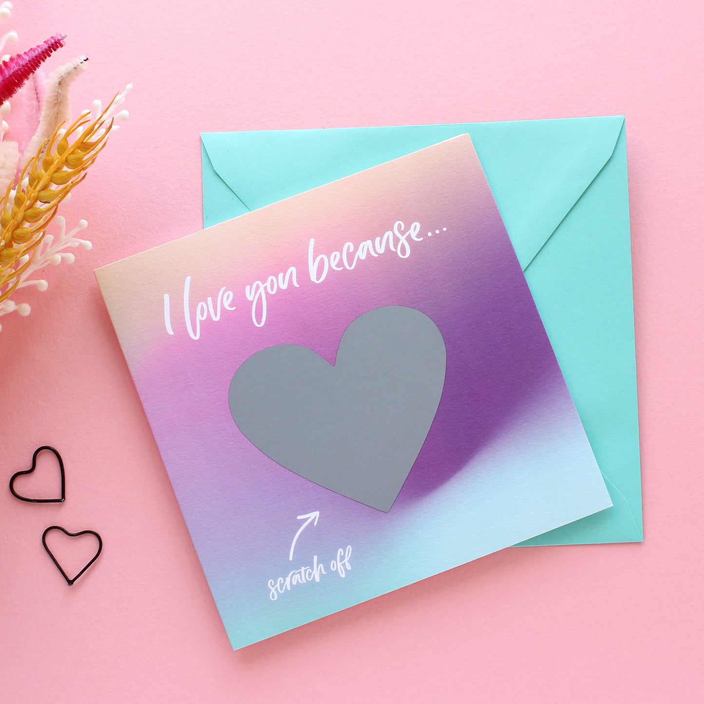 Love you because scratch off Valentines card with turquoise envelope.